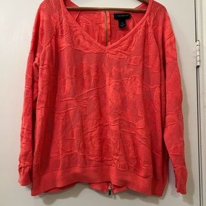 Lane Bryant coral colored V neck sweater.